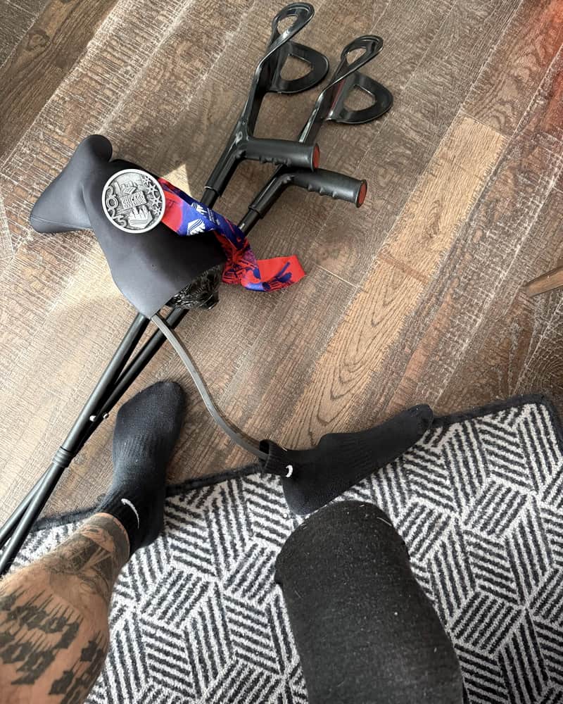 My crutches, my prosthetic liner and the Chicago medal on the floor at home